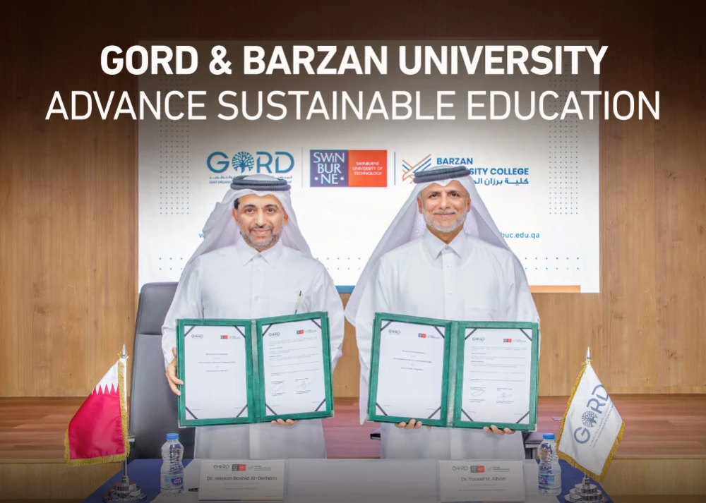 Dr. Yousef Alhorr and Dr. Hassan Al-Derham signing sustainability agreement